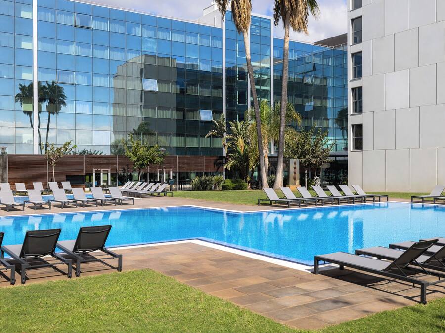 Seasonal outdoor pool, open 11:00 AM to 7:00 PM, pool loungers