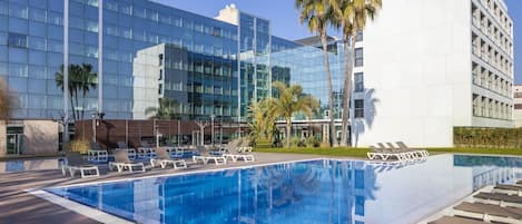 Seasonal outdoor pool, open 11:00 AM to 7:00 PM, pool loungers