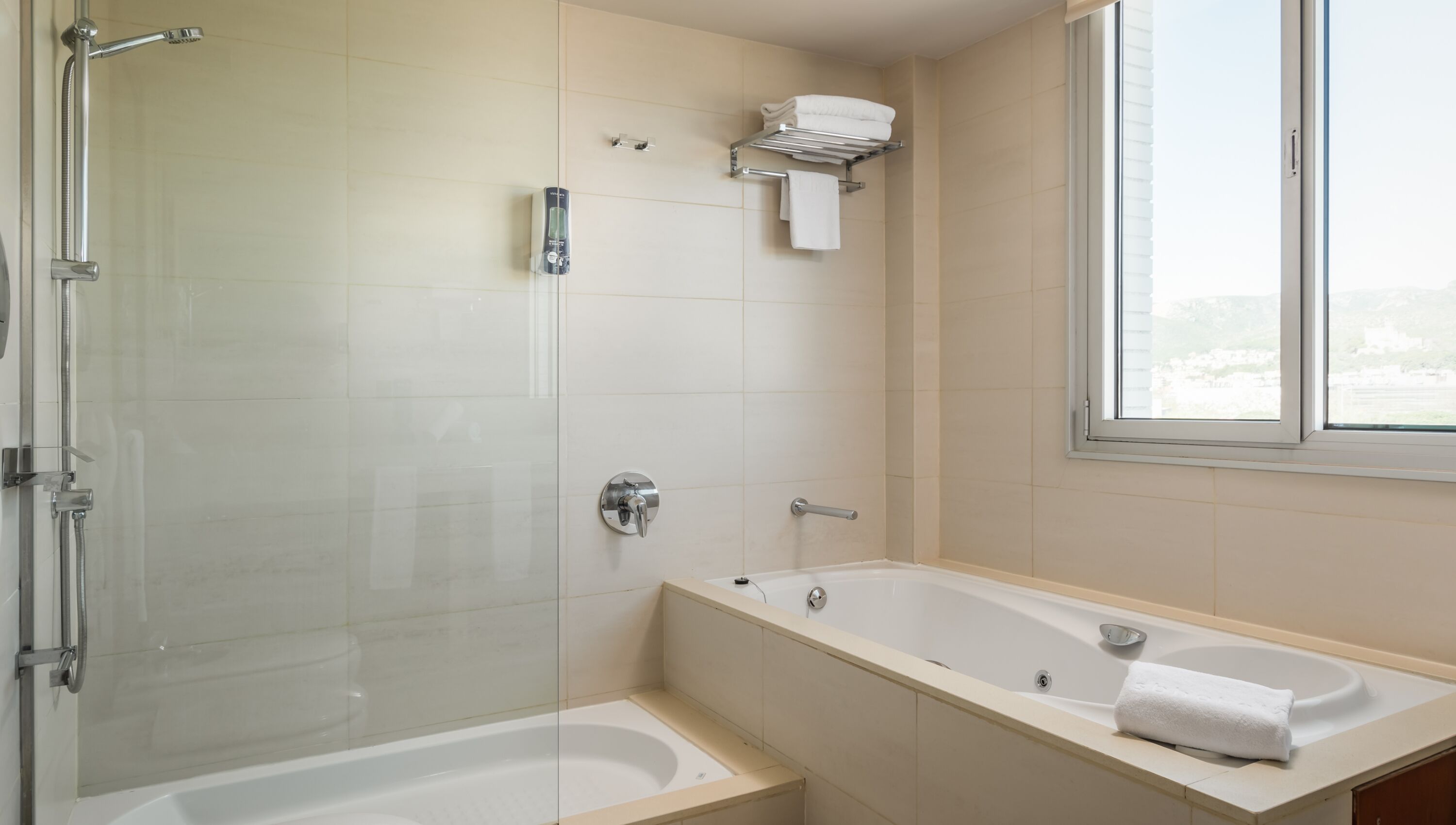 junior suite | bathroom | designer toiletries, hair dryer, towels, soap