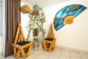 Lotus Room | Living area | 26-inch TV with cable channels