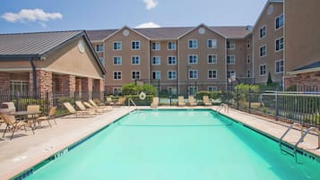 Outdoor pool, open 10:00 AM to 10:00 PM, pool loungers