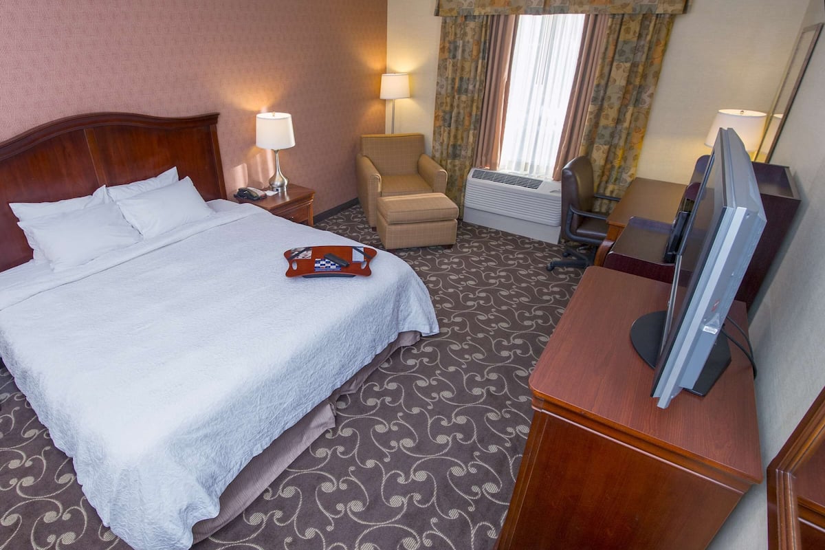 desk, laptop workspace, blackout curtains, iron/ironing board