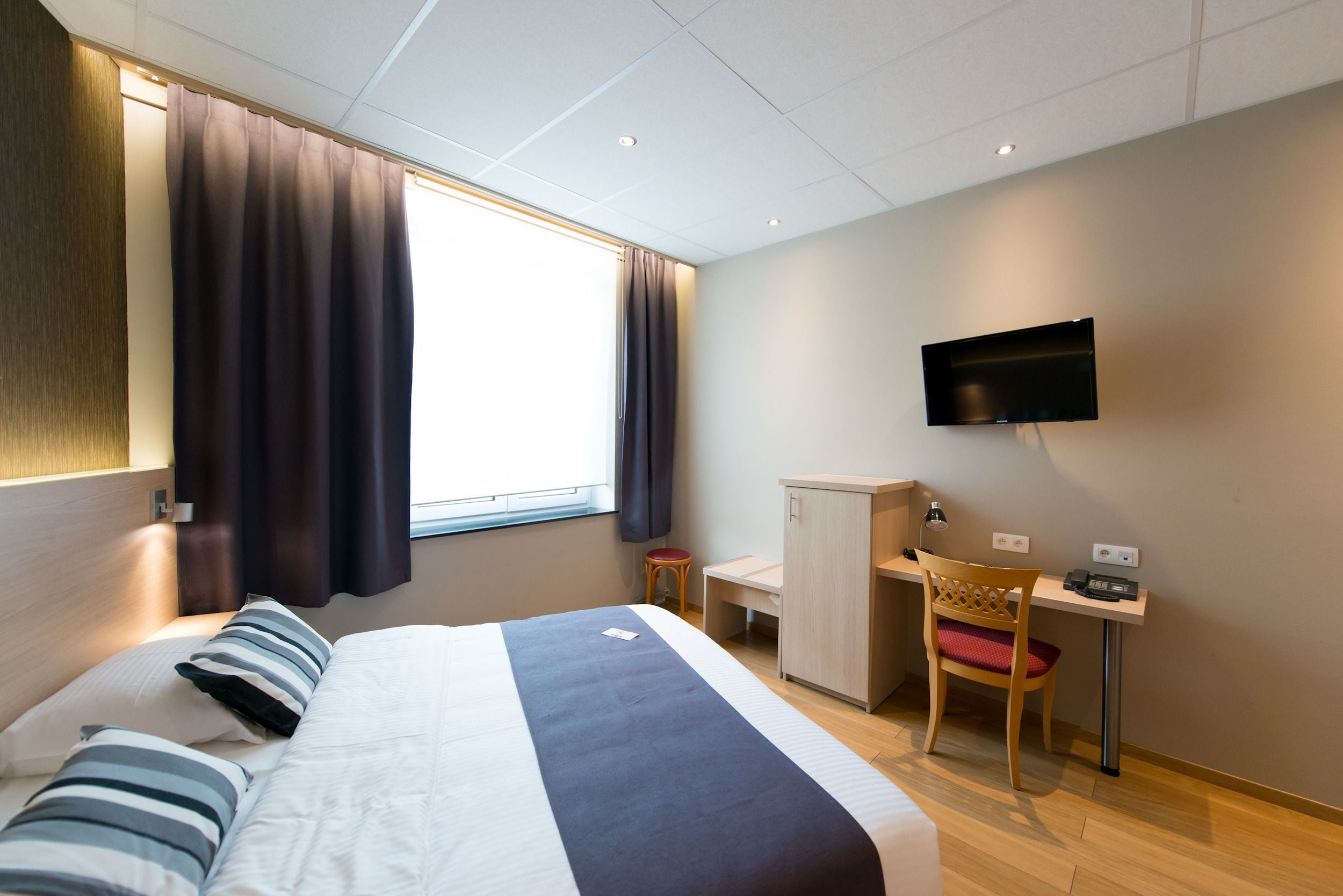 economy double room | select comfort beds, in-room safe, desk, soundproofing