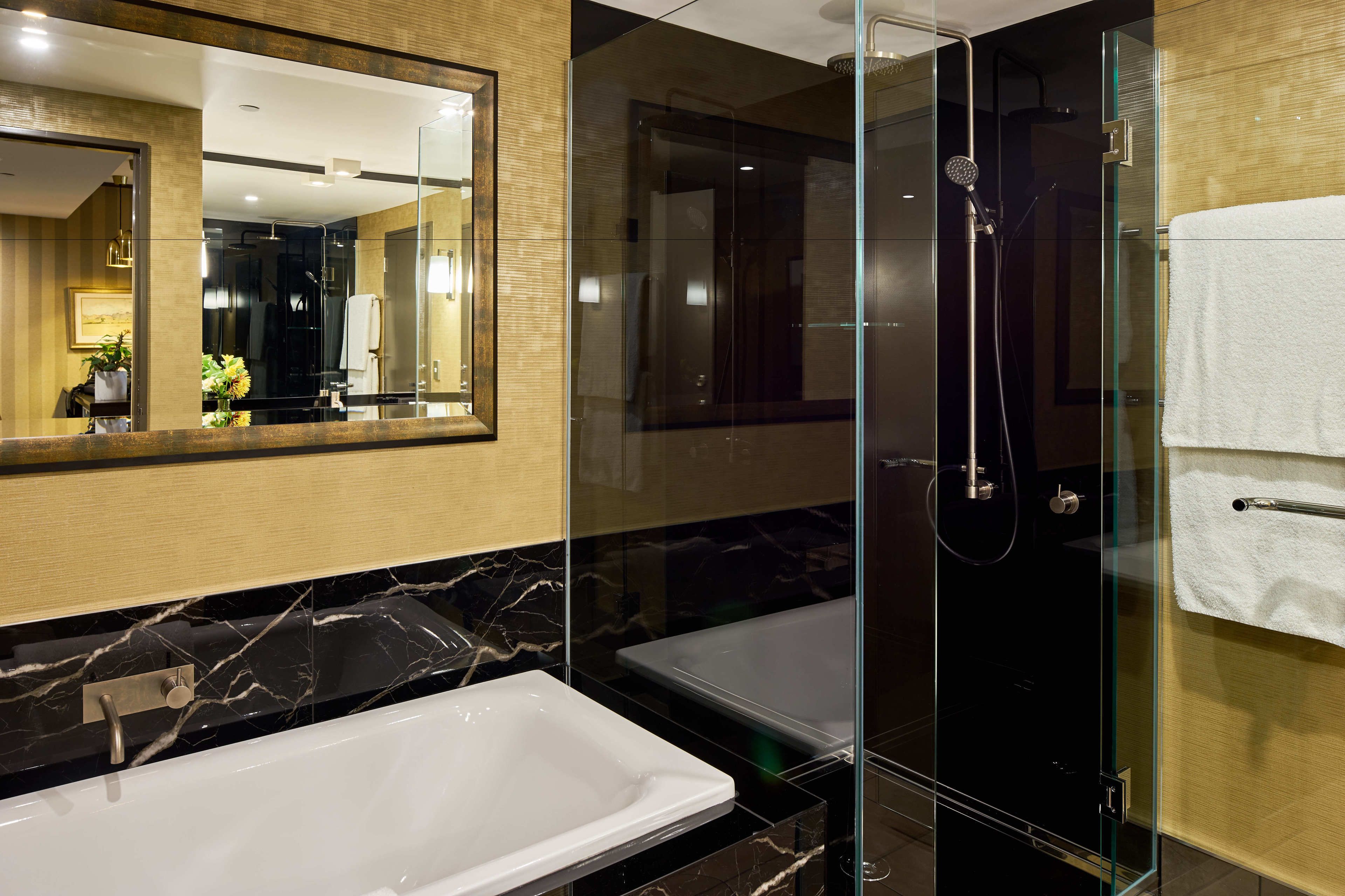 premier suite, 1 king bed | bathroom | designer toiletries, hair dryer, bathrobes, slippers