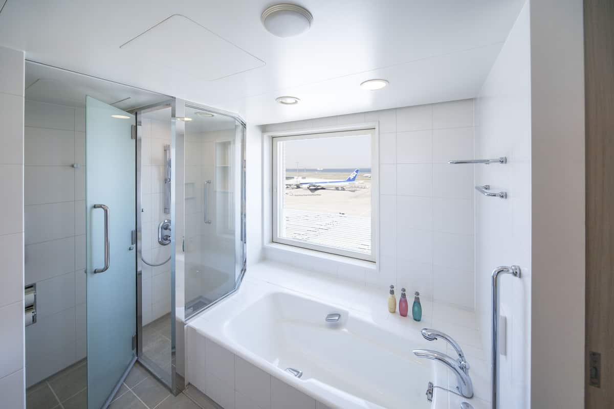 premier twin room, non smoking (view bath) | bathroom | combined shower/bathtub, free toiletries, hair dryer, slippers