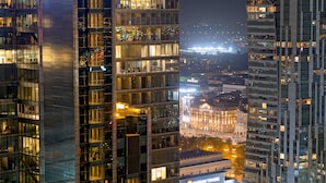 A high-rise building with multiple floors, large windows, and a view of the cityscape below. - Polonia Palace Hotel (Warsaw)
