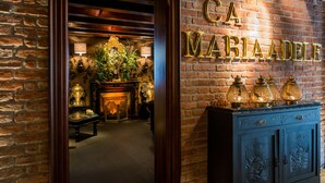 A brick wall with the name "CA MARIA ADELE" in gold letters. - Ca Maria Adele (Venice)