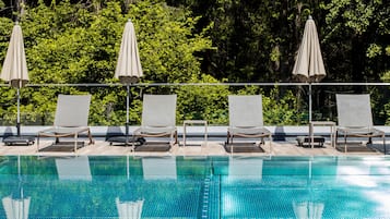 Indoor pool, outdoor pool, pool umbrellas, sun loungers