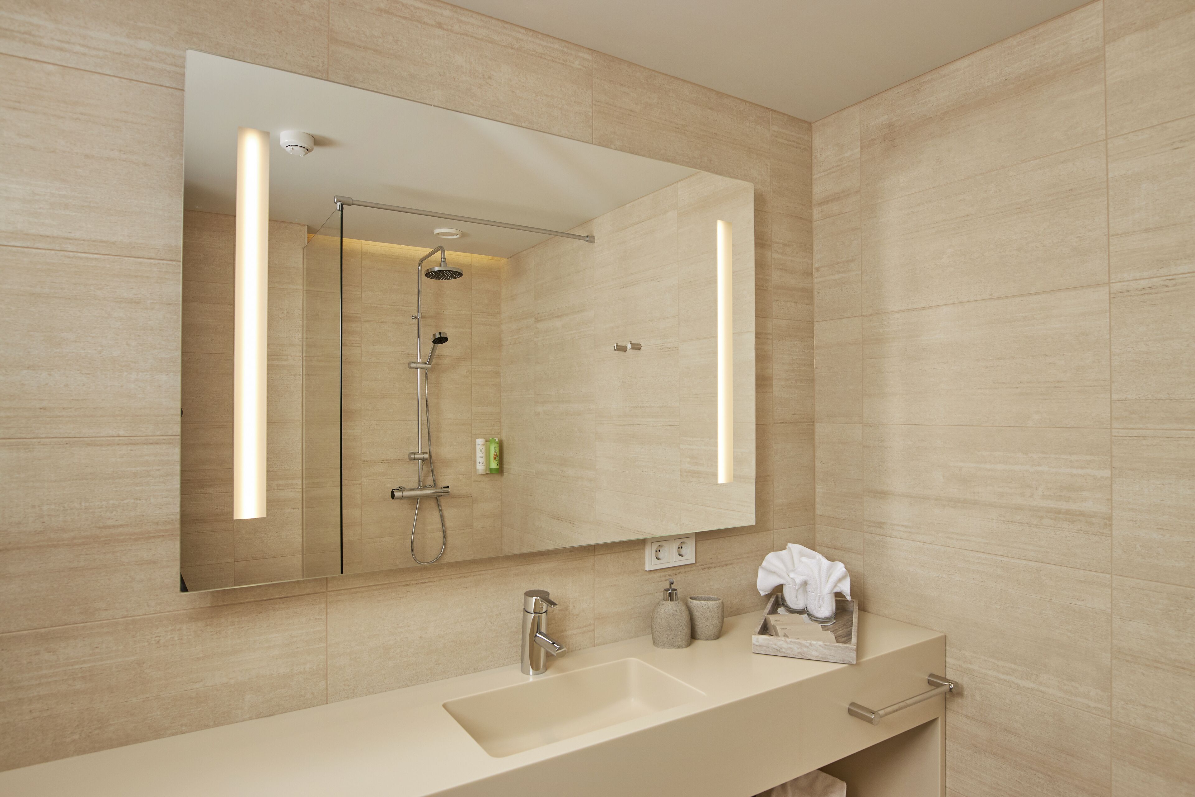 suite | bathroom | shower, rainfall showerhead, hair dryer, towels