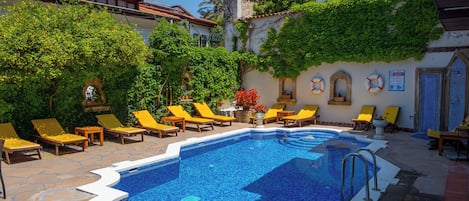 Outdoor pool, free cabanas, pool umbrellas
