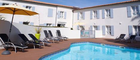 Outdoor pool, open 9:00 AM to 7:30 PM, pool loungers