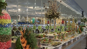 A buffet with various food items and decorations.