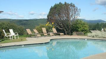 Outdoor pool, open 7:00 AM to 9:00 PM, pool loungers