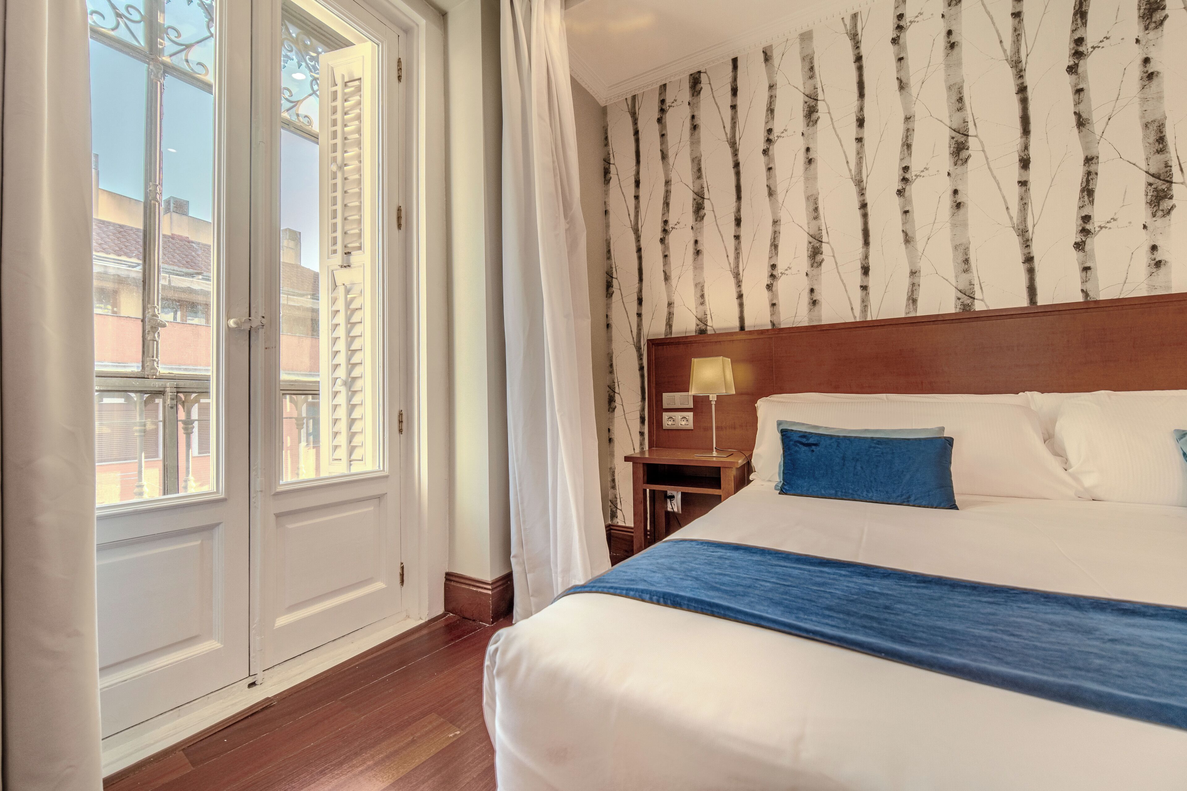 triple room, city view | minibar, in-room safe, desk, blackout curtains