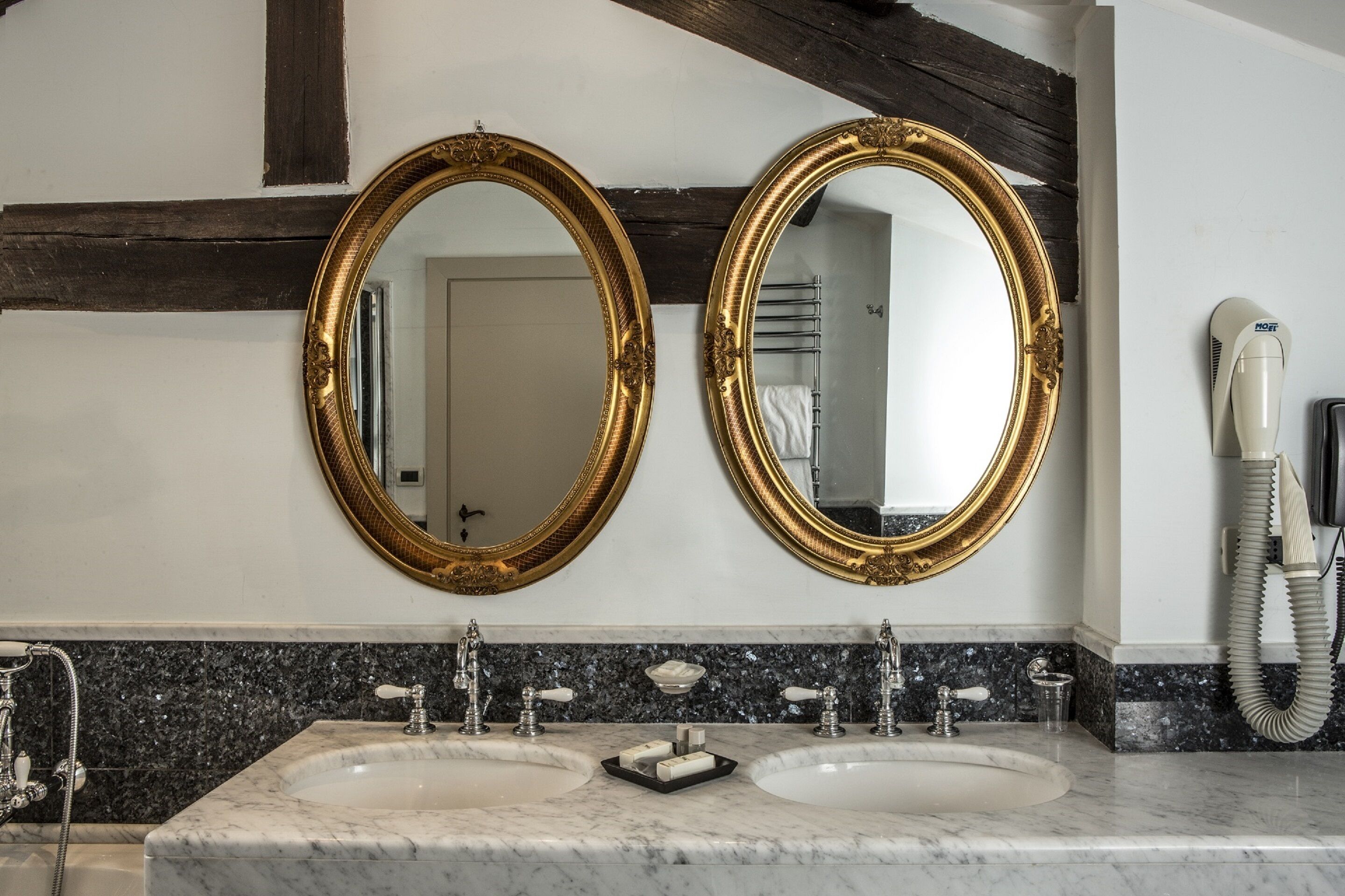 executive suite | bathroom | hair dryer, bidet, towels