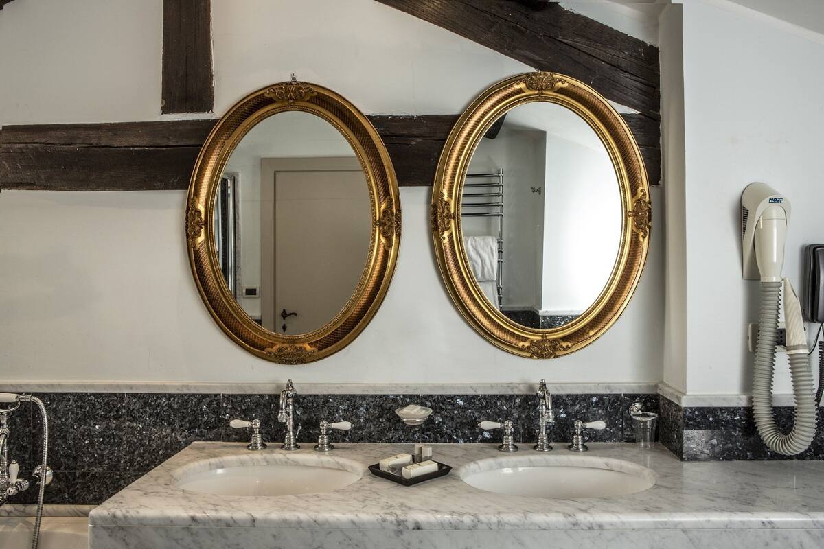 executive suite | bathroom | hair dryer, bidet, towels