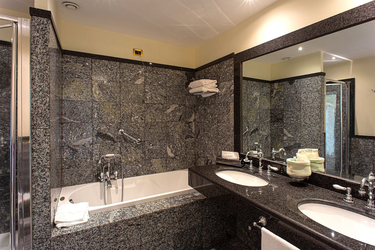 suite | bathroom | hair dryer, bidet, towels