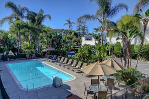 Outdoor pool, open 7:00 AM to 10:00 PM, pool umbrellas, pool loungers