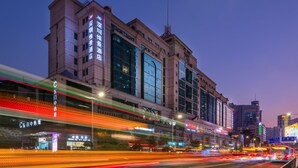 A large hotel building with multiple floors and a prominent entrance.