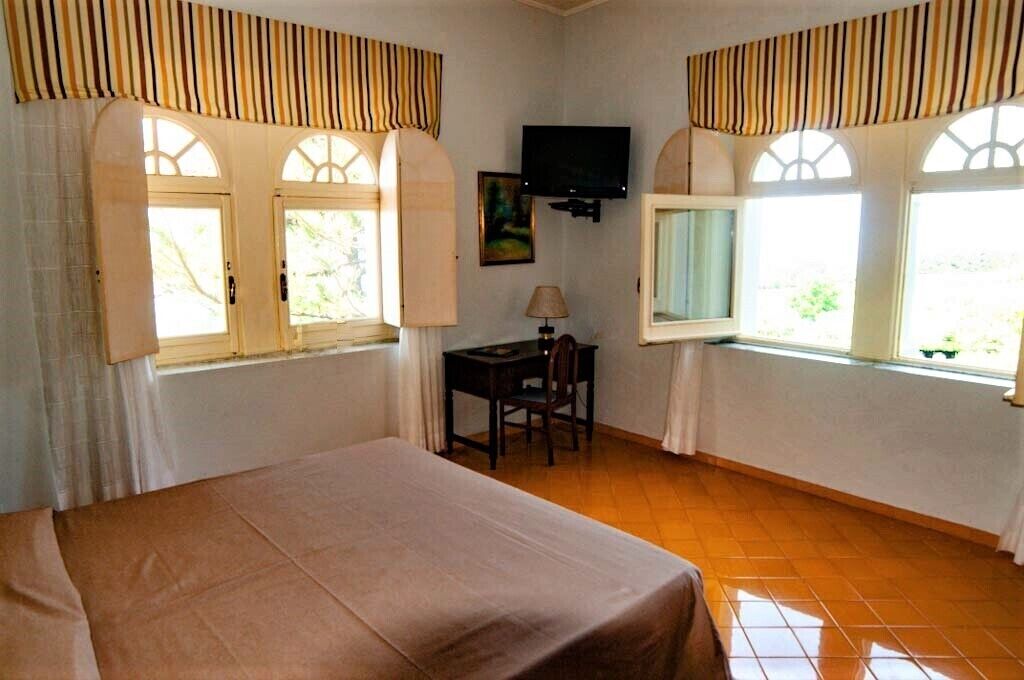 double or twin room, 1 double or 2 single beds, sea view | minibar, in-room safe, desk, blackout curtains