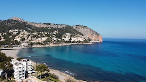 A coastal town with buildings on a hillside overlooking the sea. - Canyamel Classic & Spa, solo Adultos (Capdepera)