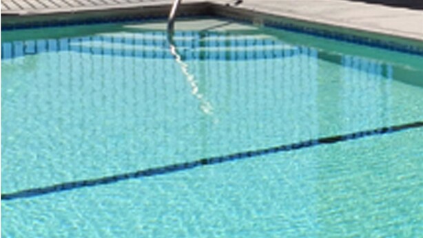 A clear blue pool with visible lane markings. - High Desert Motel Joshua Tree National Park (Joshua Tree)
