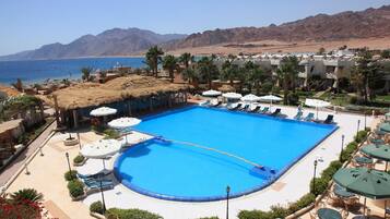 Outdoor pool, pool umbrellas, sun loungers
