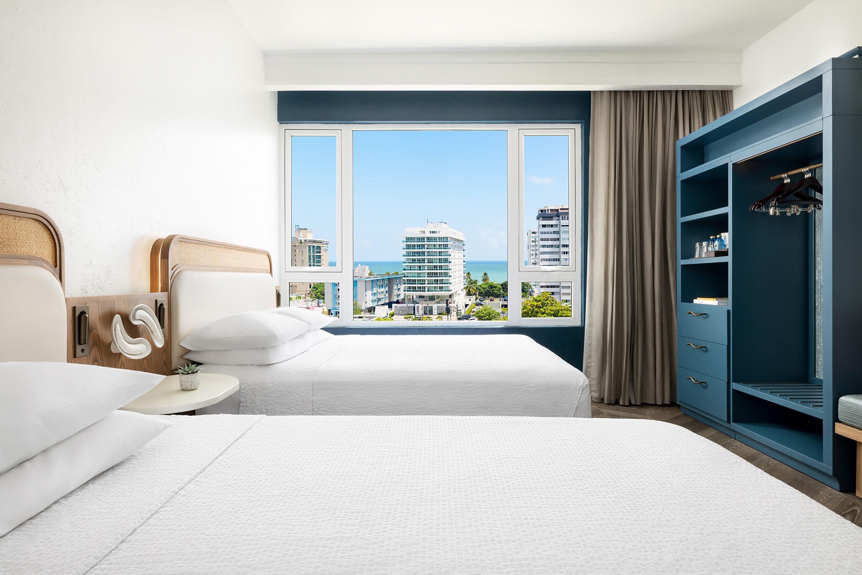 Room, 2 Queen Beds, Pool View | In-room safe, individually decorated, individually furnished