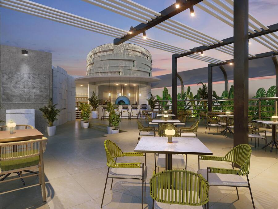 An outdoor dining area with tables and chairs, a circular building in the background, and potted plants.