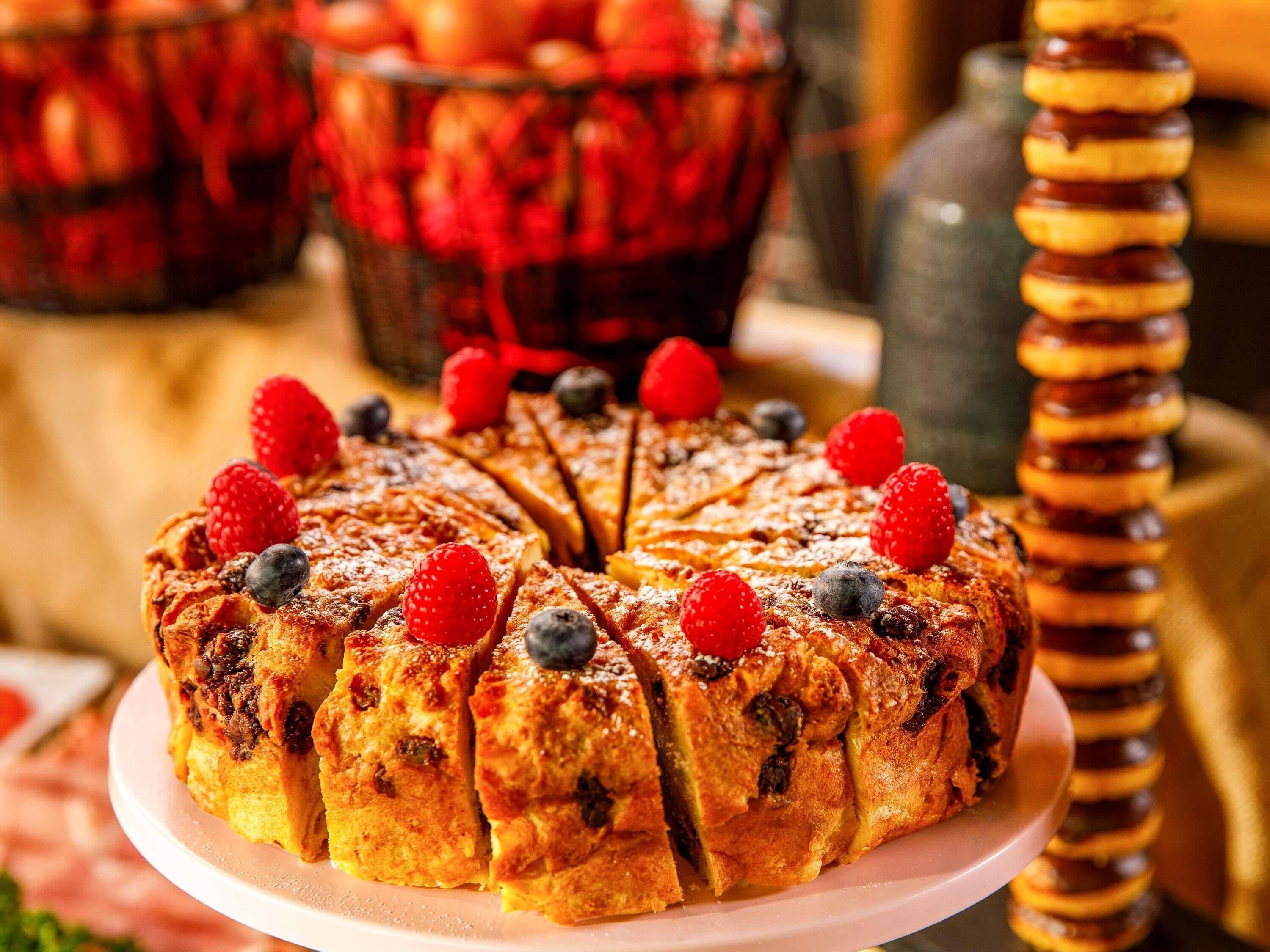 A dessert with fruit toppings on a plate.