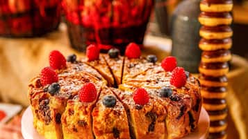 A dessert with fruit toppings on a plate.