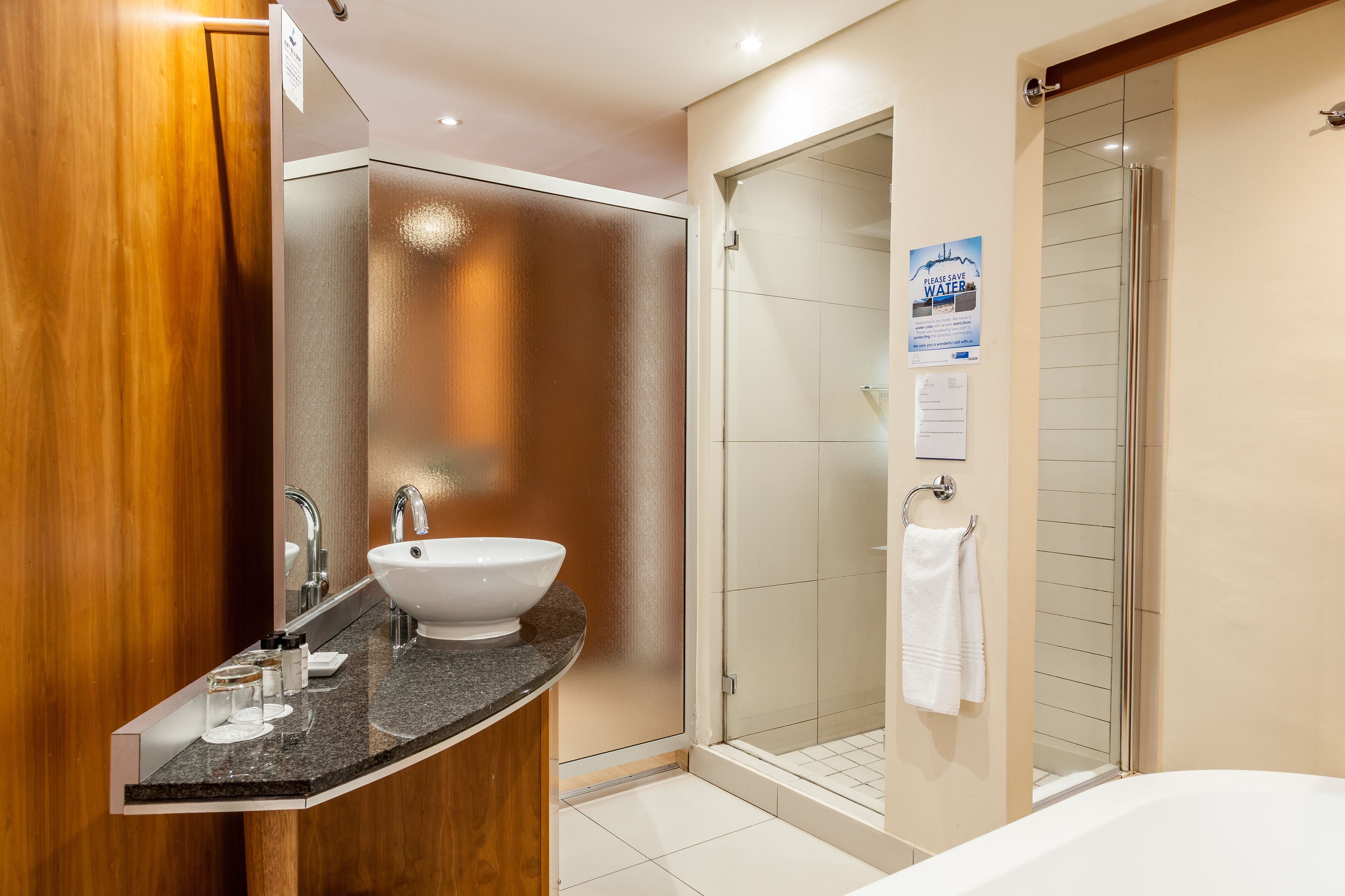 deluxe room | bathroom | separate bathtub and shower, free toiletries, hair dryer, towels