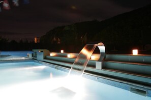 Outdoor pool, open 10:00 AM to 10:00 PM, pool umbrellas
