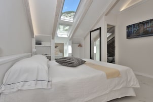 Ropa de cama de alta calidad, minibar, caja fuerte y escritorio