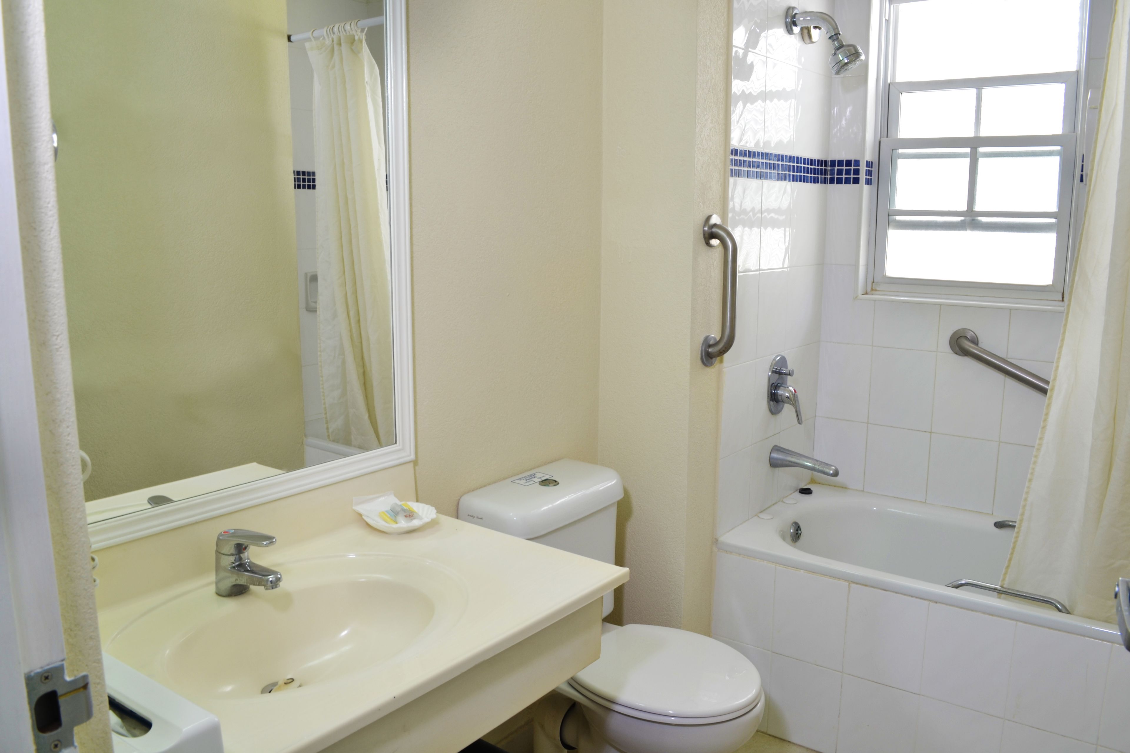 deep-soaking bathtub, rainfall showerhead, free toiletries, hair dryer