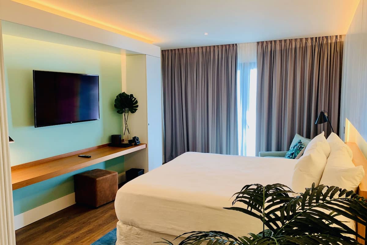 Executive Suite - City View | Premium bedding, in-room safe, laptop workspace, iron/ironing board
