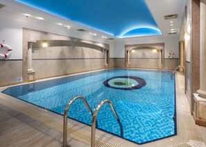 Swim laps in the pool surrounded by a clean design and a distinctive pattern in the center.
