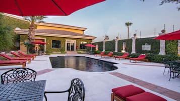Outdoor pool, open 10:00 AM to 6:00 PM, pool loungers