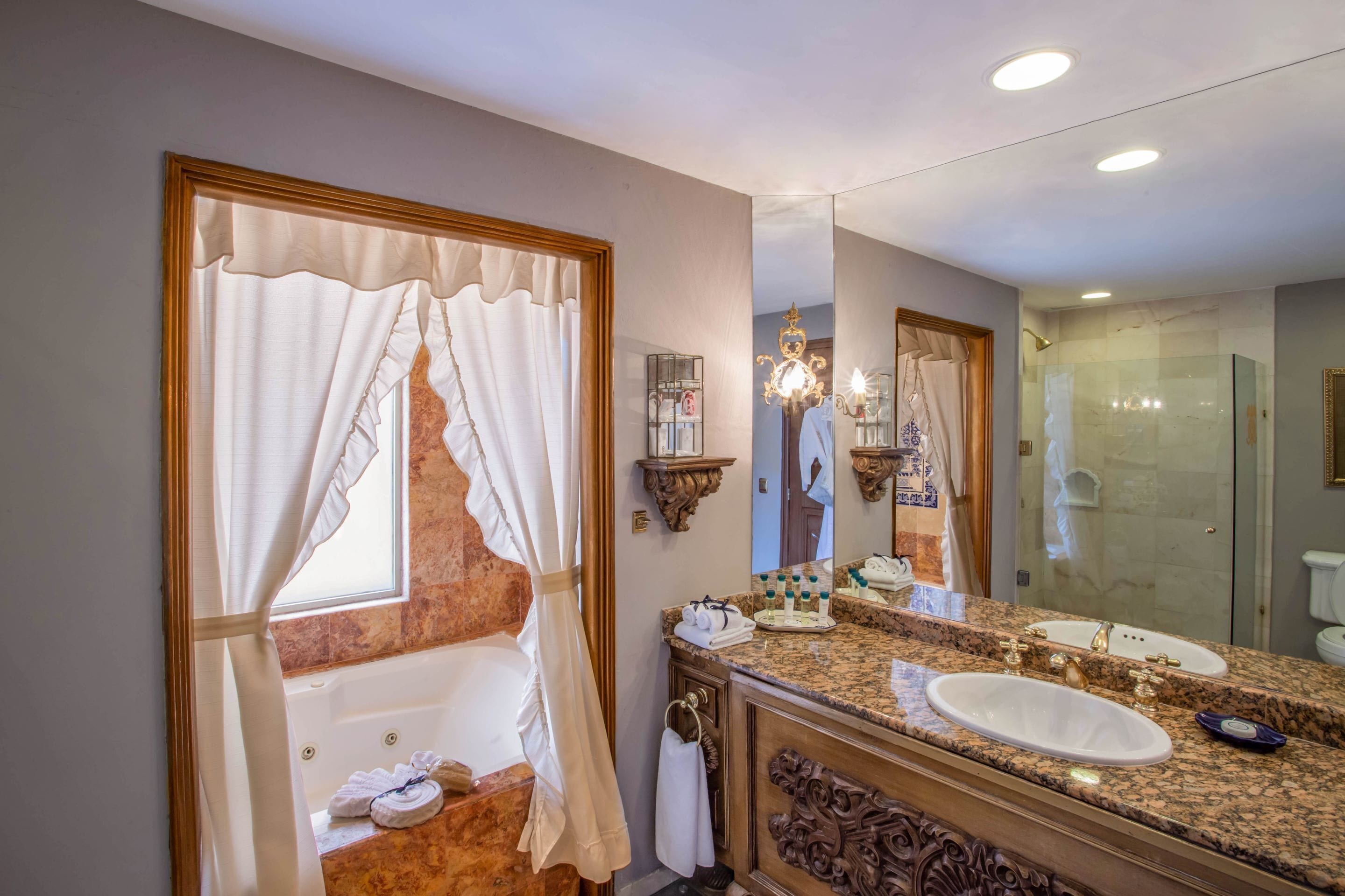 junior suite | bathroom | designer toiletries, hair dryer, bathrobes, slippers