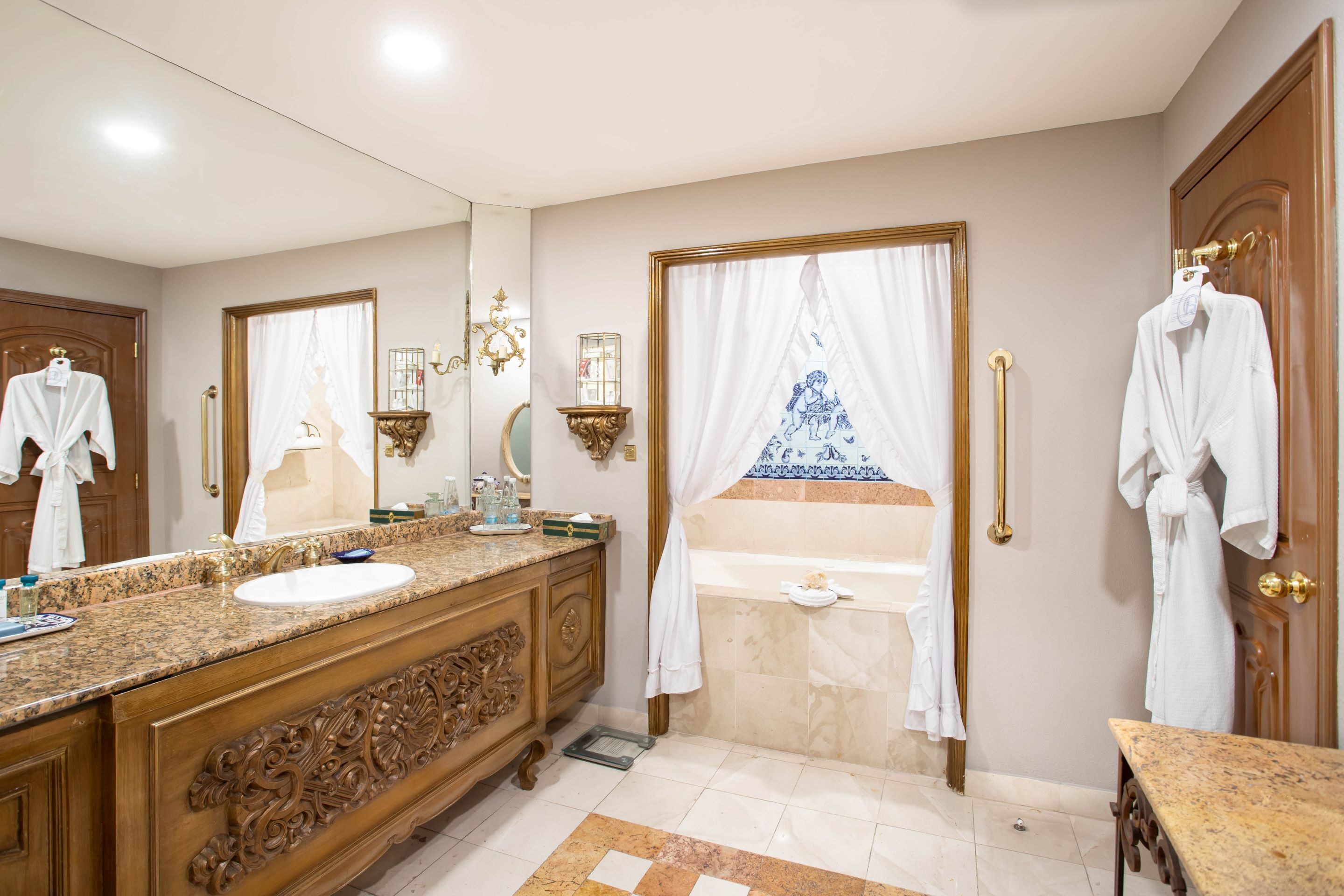 designer toiletries, hair dryer, bathrobes, slippers