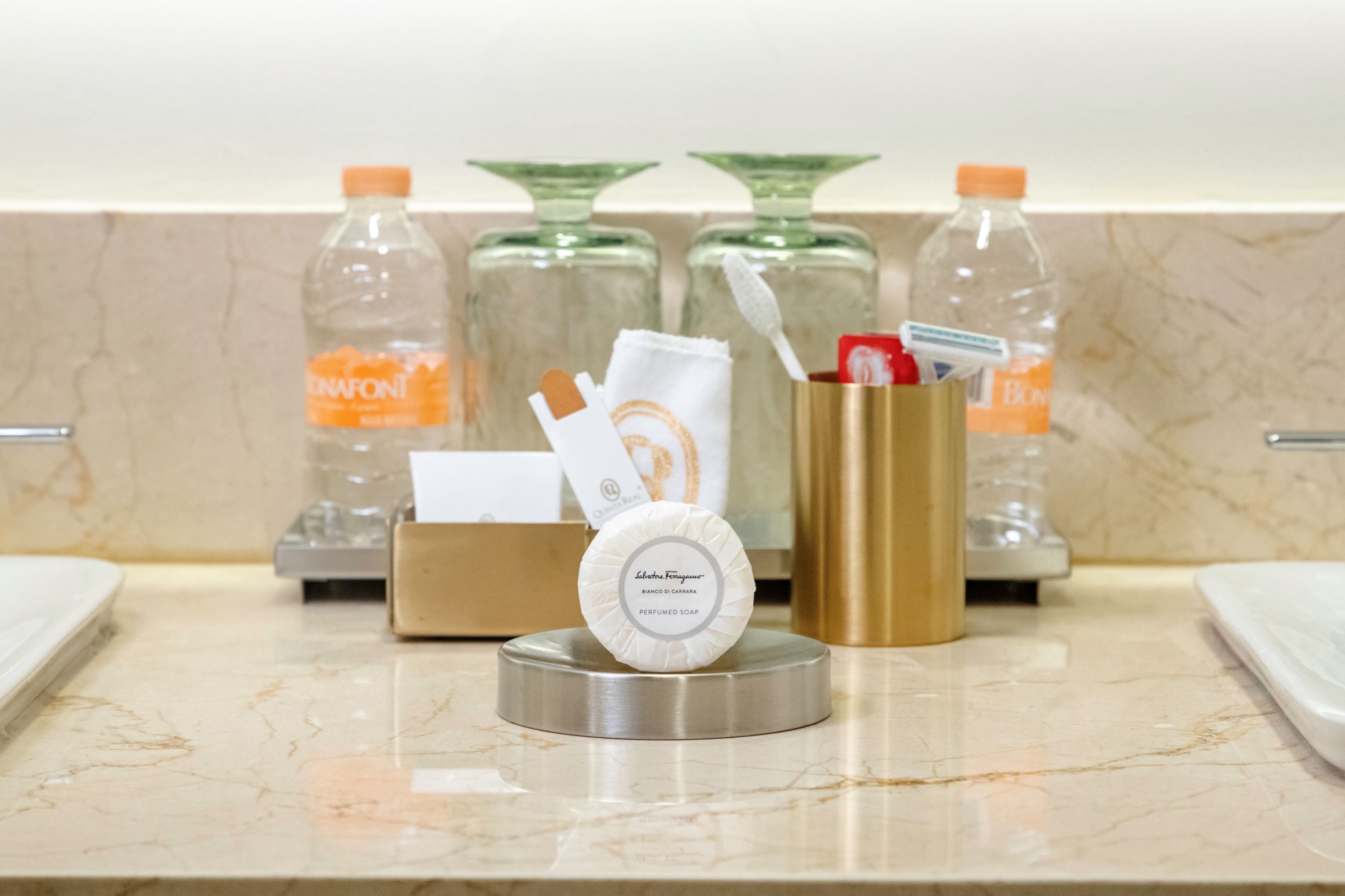 designer toiletries, hair dryer, bathrobes, slippers