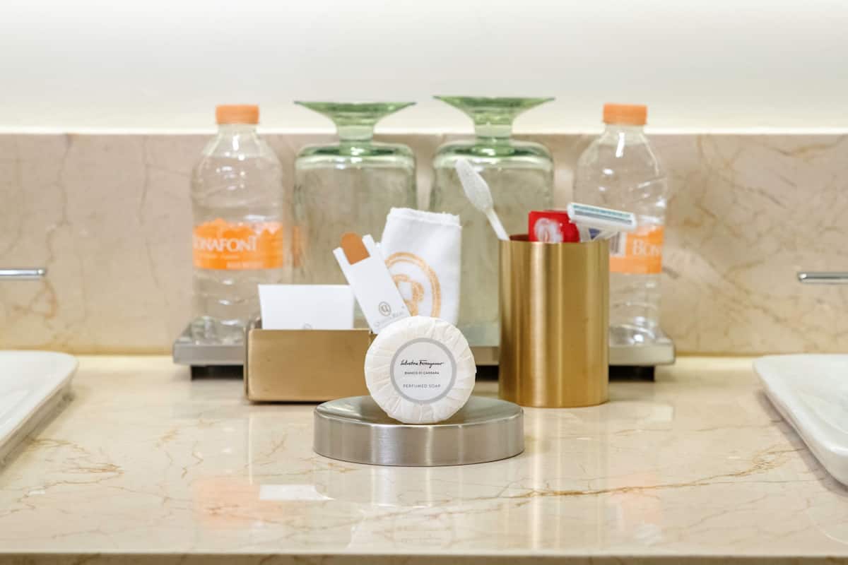 designer toiletries, hair dryer, bathrobes, slippers