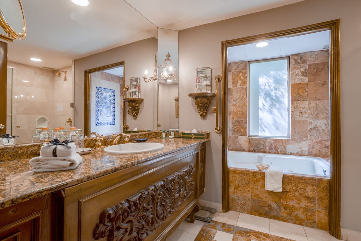 junior suite | bathroom | designer toiletries, hair dryer, bathrobes, slippers