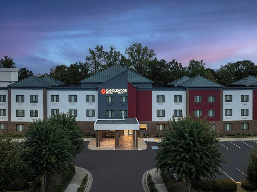A Candlewood Suites hotel with a central entrance, multiple floors, and a parking lot.