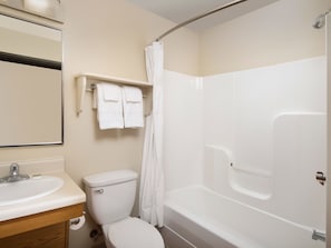A bathroom with a toilet, sink, and bathtub. - Extended Stay America Select Suites - Wichita - North (Wichita)