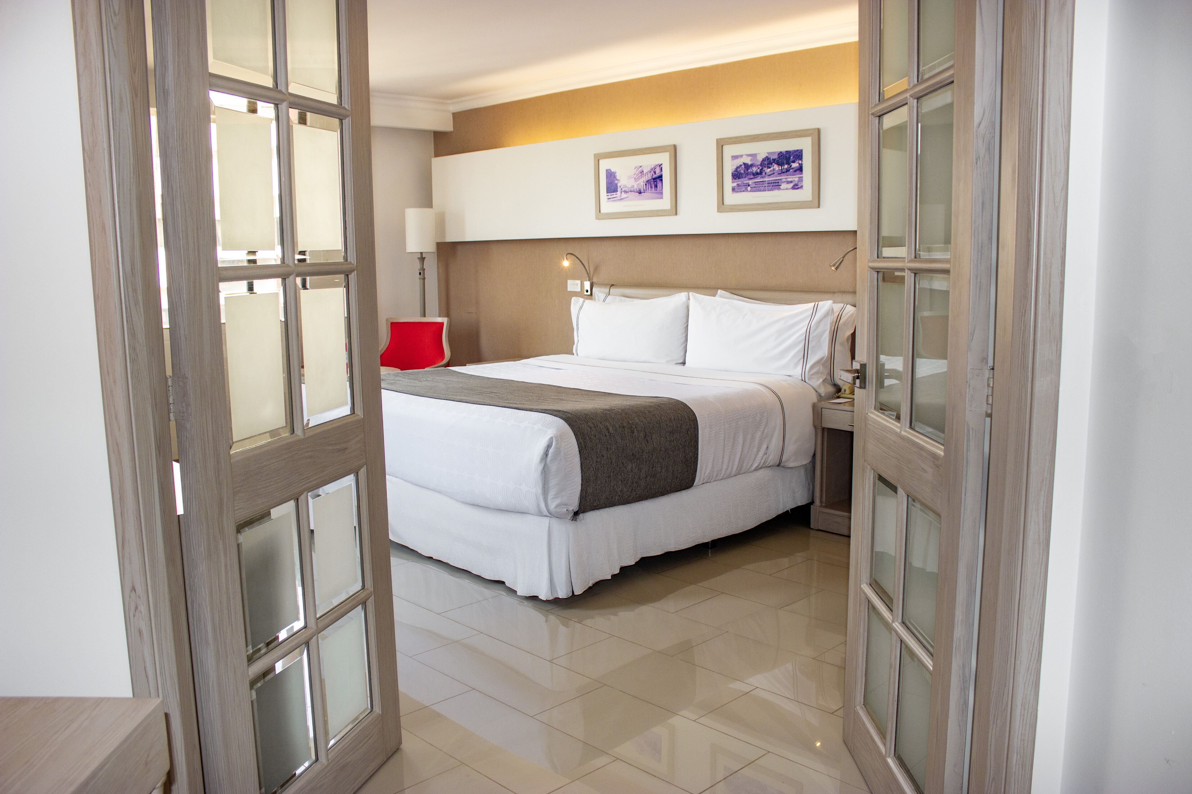 Suite, 1 King Bed (Suite Junior) | In-room safe, desk, blackout drapes, iron/ironing board