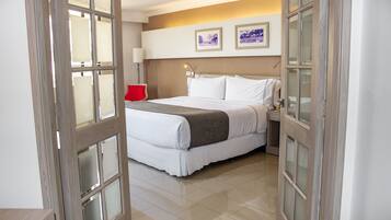 Suite, 1 King Bed (Suite Junior) | In-room safe, desk, blackout drapes, iron/ironing board