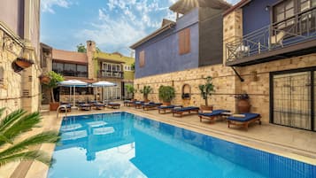 Outdoor pool, open 9 AM to 6 PM, pool umbrellas, pool loungers