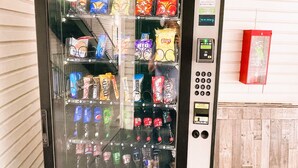 A vending machine stocked with snacks and drinks. - Evergreen Inn (Branson)