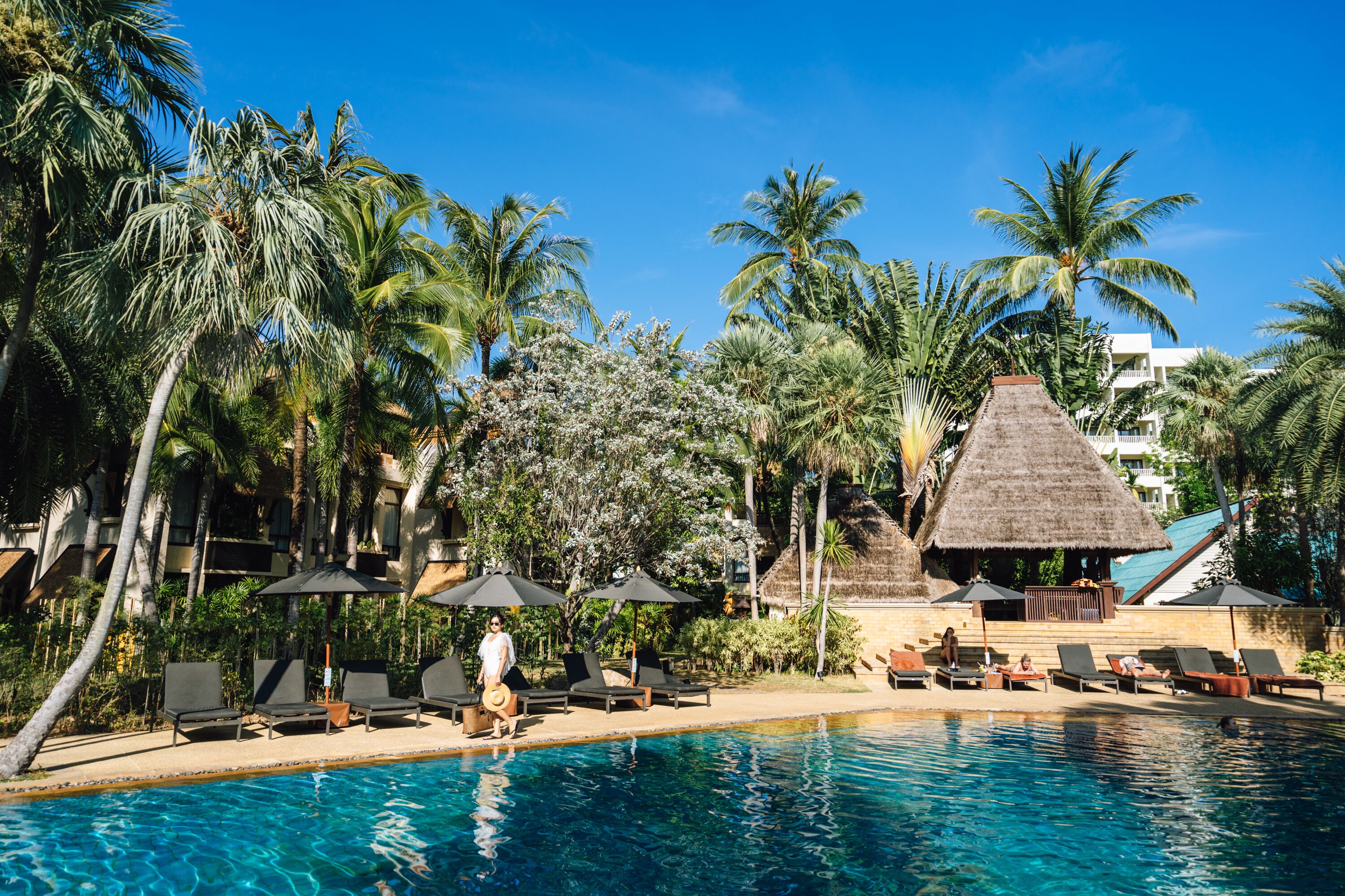 outdoor pool, open 7:00 am to 7:00 pm, pool umbrellas, pool loungers